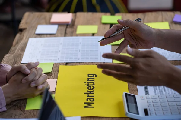 Diverse Startup Teamwork and Integration Ideas: Business Team Coworker Brainstorm Business Ideas Close group discussions with paper on the table plan to work with colleagues in the office.