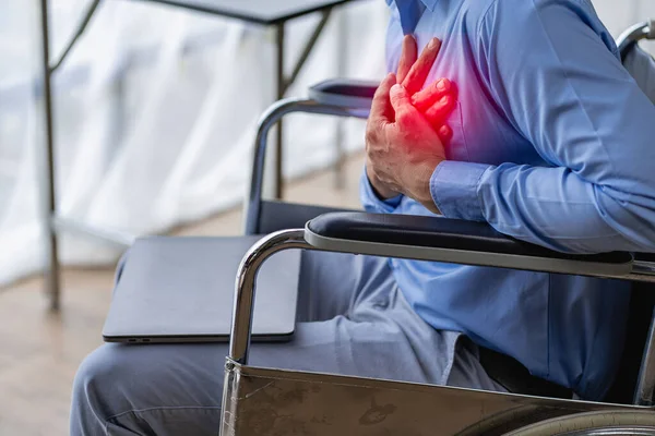 Men have a heart attack. health care concept The man had severe heart pain and chest pain to the point of suffocation, highlighting the red dots.