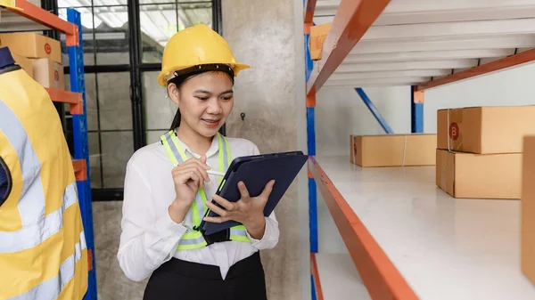 man, woman, asia, helmet, safety, employee, check, order, shelves, shipping, manager, storage, factory, industries, carrying, boxes, logistics, goods, supervisor, engineer delivery concept