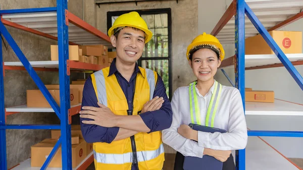 man, woman, asia, helmet, safety, employee, check, order, shelves, shipping, manager, storage, factory, industries, carrying, boxes, logistics, goods, supervisor, engineer delivery concept