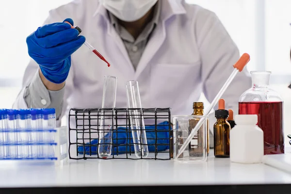 Research Concept Medical scientists have experimented with liquid chemicals in vitro to analyze virus data in a chemistry laboratory.