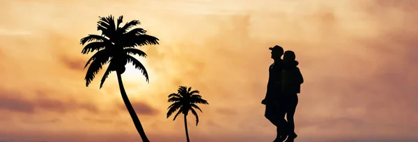 Silhouette of couple walking on the beach hugging each other at sunset - romantic hug and sunset at the tropical ocean beach - Happy honeymoon photo.