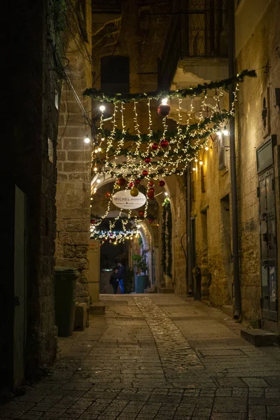 light decorations and christmas trees during new year celebration in Nazareth city in 2021
