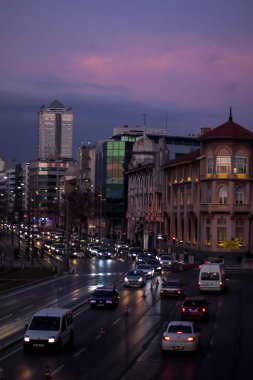 Izmir, Turkey, 4th of January 2022 - Cars - Vehicles passing on the Mustafa Nemal Sahil Boulevard during sunset