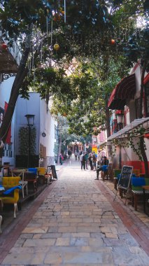 Izmir, Turkey, 5th of January 2022 - Cozy street of Izmir during the day with shops and restaurants