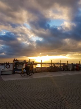 Izmir, Turkey, 5th of January 2022 - Sidewalk at the Aegean Sea during sunset on the coast of Izmir with copy space