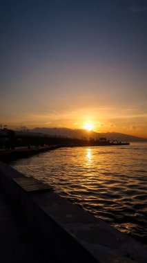 Sunset on the coast -bay of Aegean Sea in Izmir, Turkey with copy space