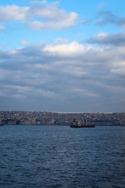 Izmir, Turkey, 5th of January 2022 - Ship on the Aegean Sea during sunset on the coast of Izmir with copy space