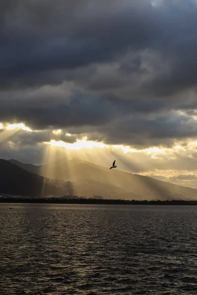 Mountains and the Aegean Sea on the coast of Izmir with copy space and sunrays