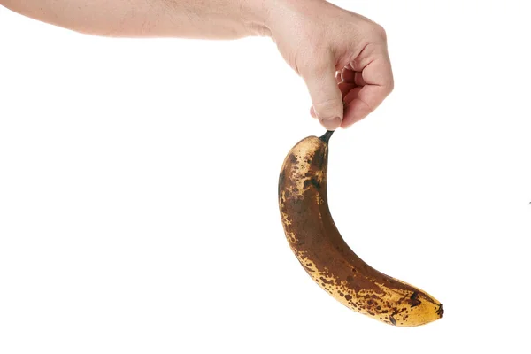 Ręka trzyma dojrzałego banana na białym tle, szablon dla projektantów — Zdjęcie stockowe