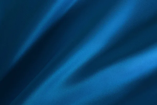 背景やデザインアート作品のための濃い青生地の布のテクスチャ シルクやリネンの美しいしわのパターン — ストック写真