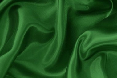 Arkaplan ve tasarım için koyu yeşil kumaş dokusu, güzel buruşmuş ipek ya da keten deseni..