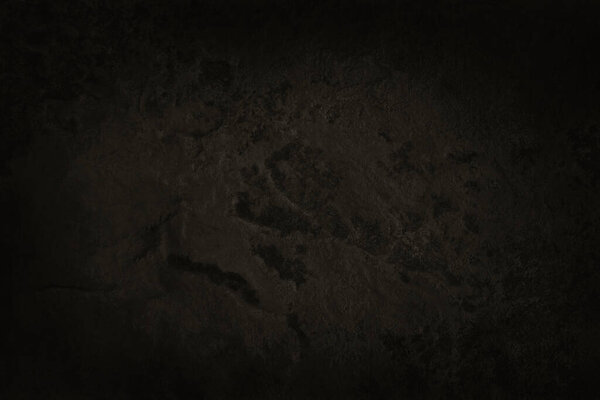 Dark brown slate stone wall texture in natural pattern with high resolution for background and design art work.