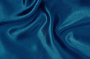 Arkaplan ve tasarım için koyu mavi kumaş dokusu, güzel buruşmuş ipek ya da keten deseni..