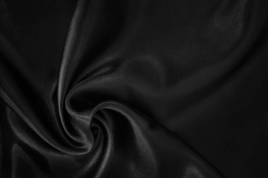 Arkaplan ve tasarım için siyah kumaş dokusu, güzel buruşmuş ipek ya da keten deseni..