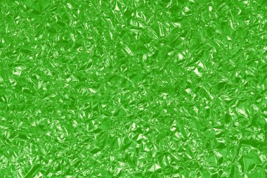 Yeşil kireç folyo parlak doku, arkaplan ve tasarım çalışmaları için soyut ambalaj kağıdı.