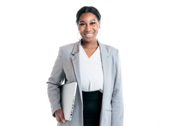 Studio portrait of a beautiful business woman dark-skinned holding a computer — Stock Photo, Image