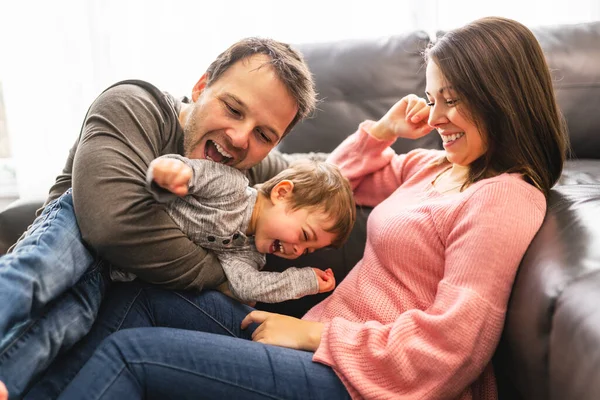 Happy family mother and father having fun with child son at home — Photo