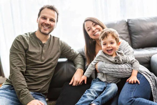 Happy family mother and father having fun with child son at home — Stockfoto