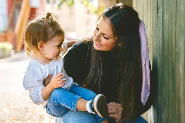 Young woman with cute two years old child outside — Stock Photo, Image