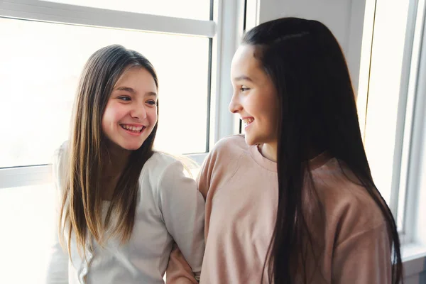 Two Teens spending time on bedroom at home — Stock Fotó