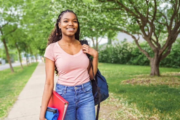 Cute black teenager university student on campus with backpack — Stockfoto