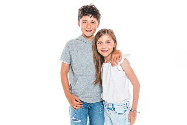 Portrait of cute girl and boy on studio white background — Stock fotografie