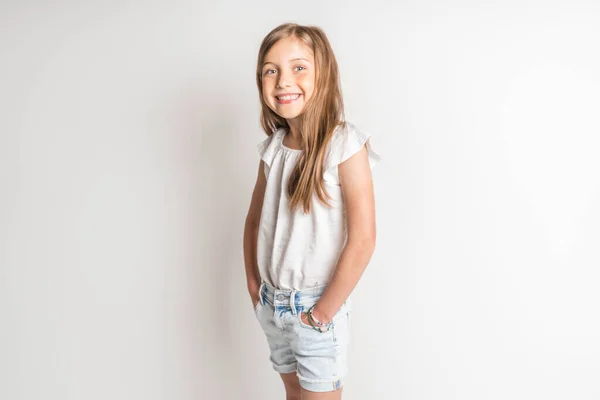 Stylish little girl portrait in the studio white background — Stock Fotó