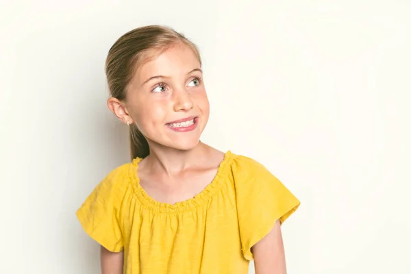 Stylish little girl portrait in the studio white background — Stock Fotó