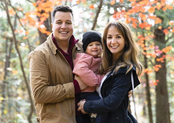 Family having fun in the autumn forest — Stock Photo, Image