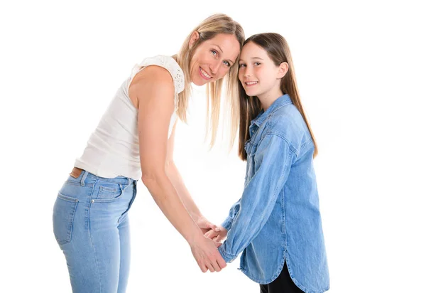 Beautiful pre teen girl with mother on studio white background — Stock Photo, Image