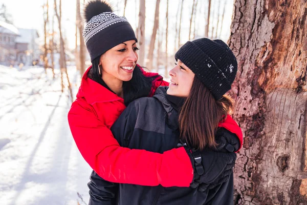 Portrait of mother with his teen girl while enjoying outdoors in winter — Stock Photo, Image