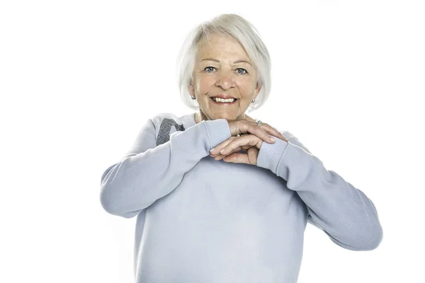Nice portrait of a retired senior woman on studio background — Stock Photo, Image