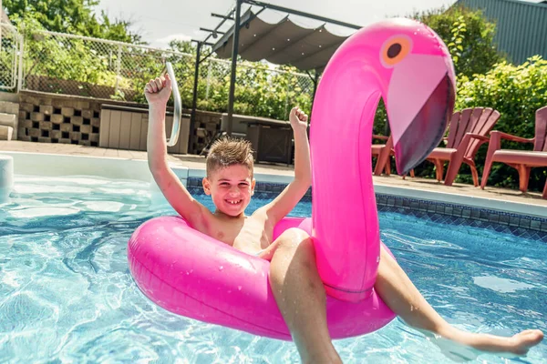 Kid having fun on in a swimming pool. —  Fotos de Stock