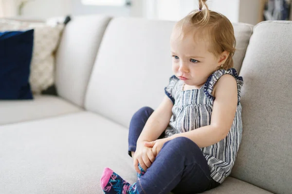 Cute little girl watching tv at home — Photo