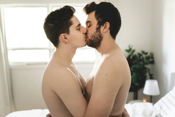 Homosexual couple under a bed at home — Stock Photo, Image