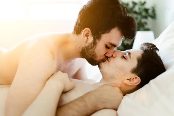 Homosexual couple under a bed at home — 스톡 사진
