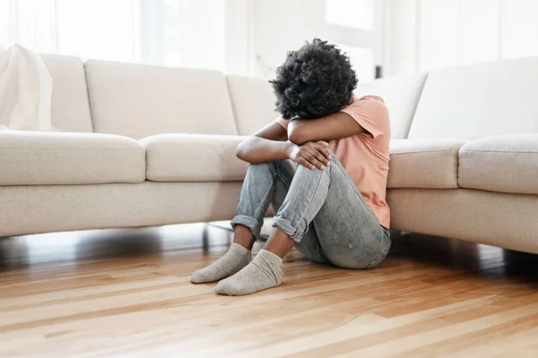 Young woman in stress on the living room