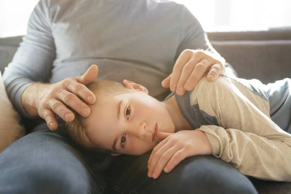 Son with problem sit on the father knee — 스톡 사진