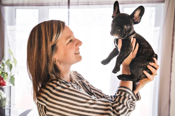 Portrait of happy adult at home with french bulldog — Stock Photo, Image