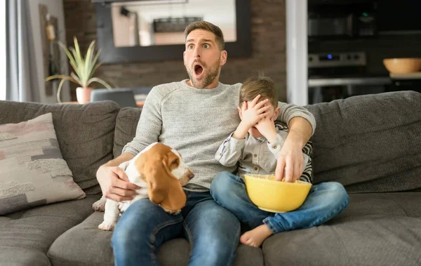 Father or Godfather with Basset dog having fun on the living room At Home watching movie with popcorn look like afraid — Stock Photo, Image
