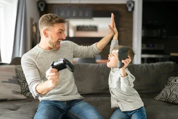 Father or Godfather having fun on the living room At Home play video game — Stock Photo, Image