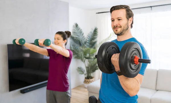 A Couple doing morning fitness at home with dumbell — Stock Fotó