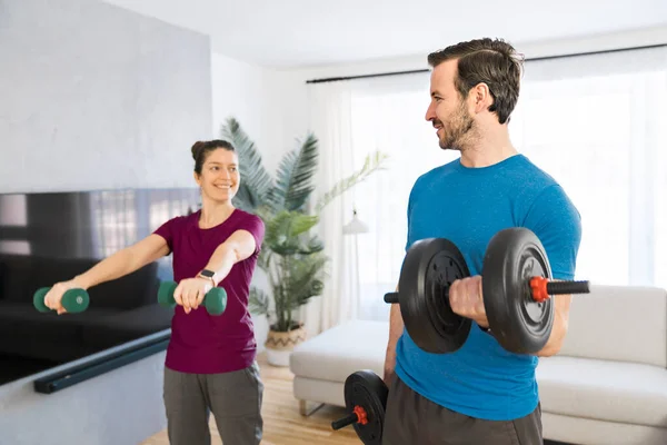 A Couple doing morning fitness at home with dumbell — Stock Photo, Image