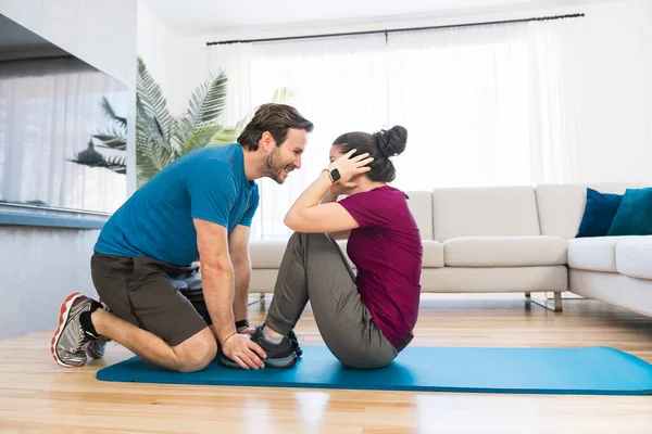 A Couple doing morning fitness at home — Stock Fotó