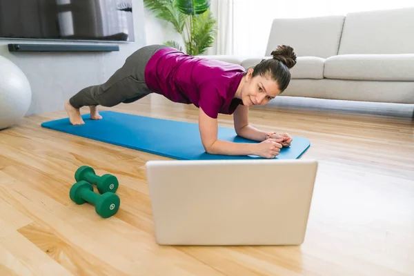Attractive Fit woman Exercise at home on the living room — Zdjęcie stockowe