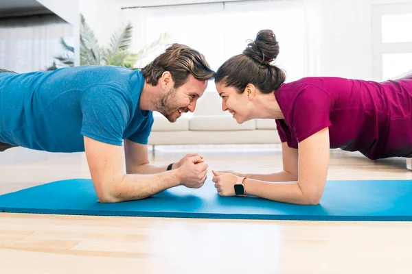 A Couple doing morning fitness at home — Stock Fotó