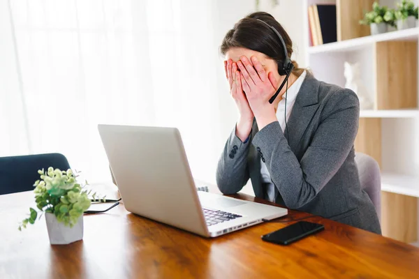 Frustrated and sad woman working on laptop at home — Foto de Stock