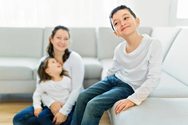 Boy on the front and mother with daughter on the back — Stockfoto