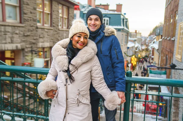 Portrait of a beautiful young couple on a winter season with coat — Fotografia de Stock